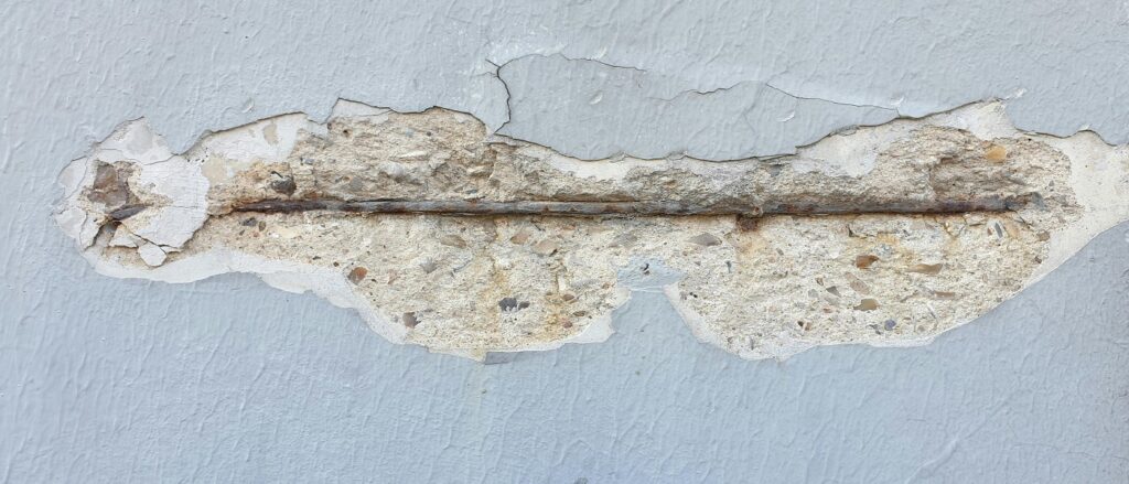 Picture of defective concrete with hole in it associated with blog on personal injury product defect specific legal issues