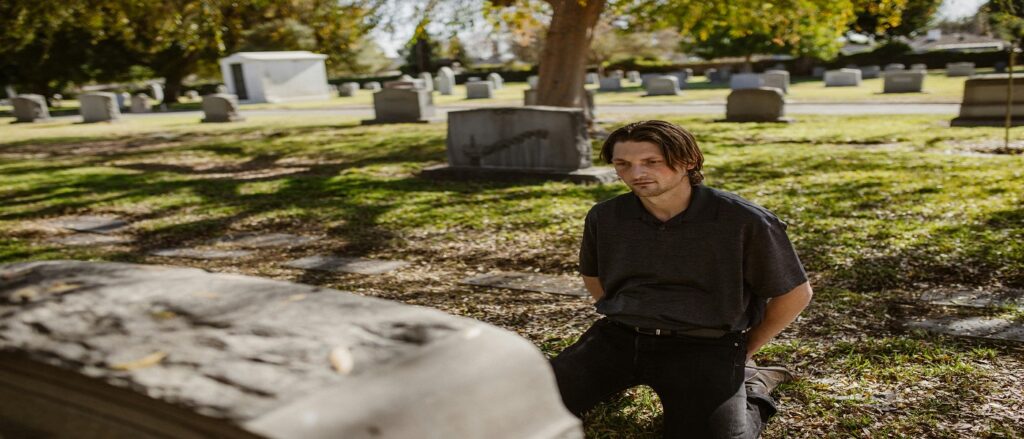 Picture of man at cemetery associated with blog on dead man's statute