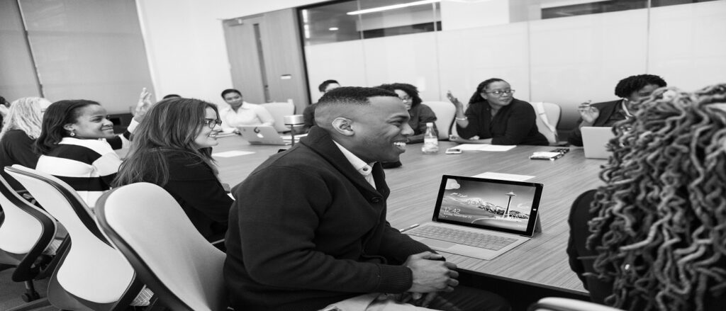 Picture of people around a table for a deposition associated with defending plaintiff's deposition