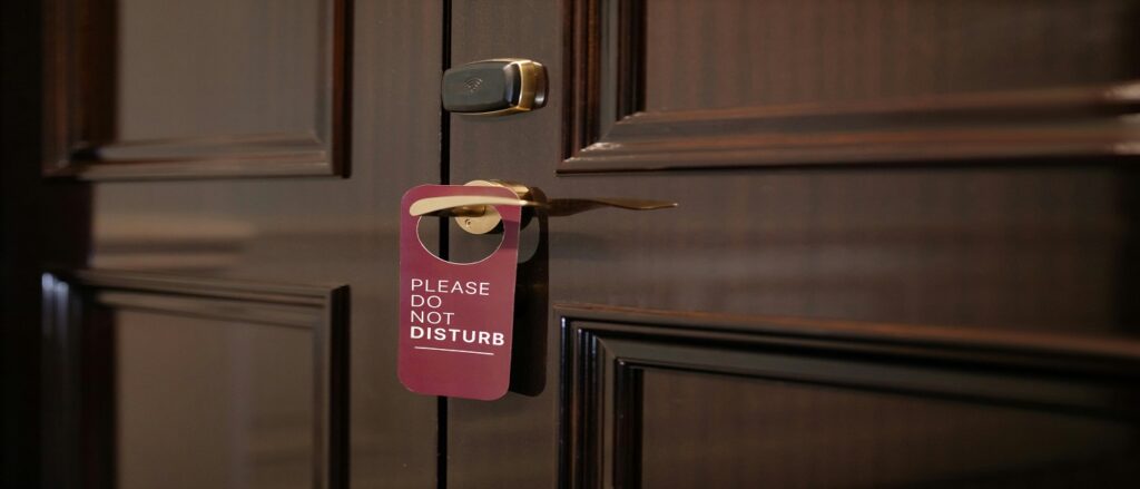 Picture of do not disturb sign on door associated with blog on constructive notice through federal register