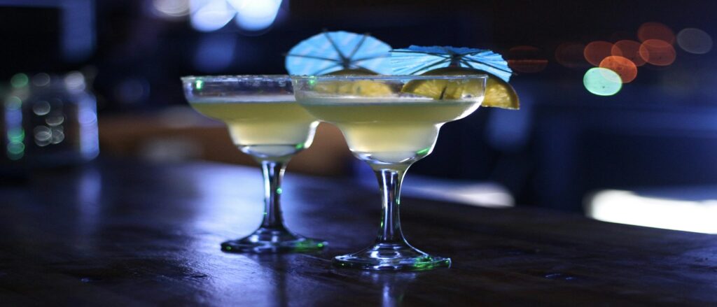 Picture of two alcoholic drinks on a bar associated with blog on car accident dram shop