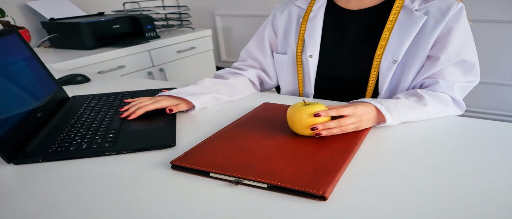 Picture of dietician with orange associated with blog on dietary malpractice