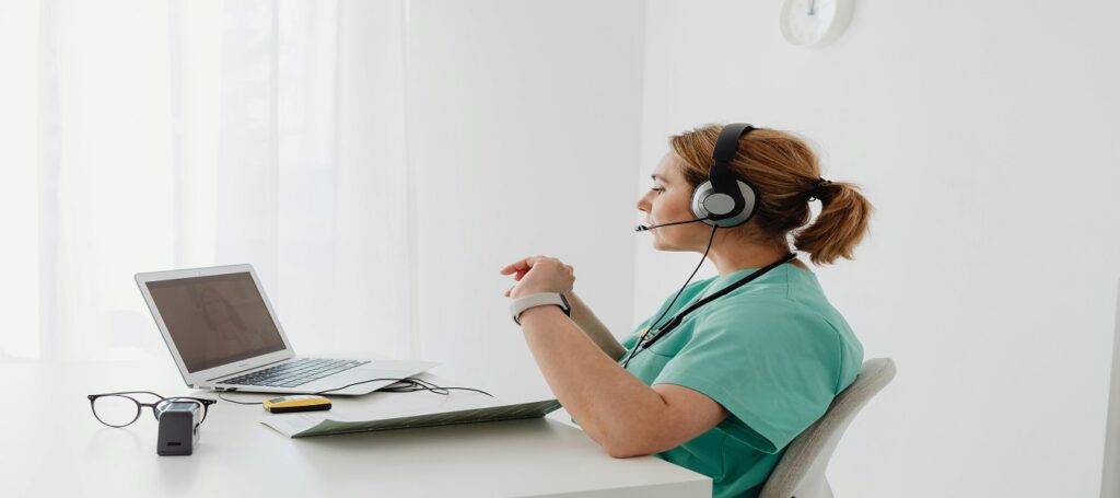 picture of doctor sitting at computer associated with blog on personal injury twelve week expert