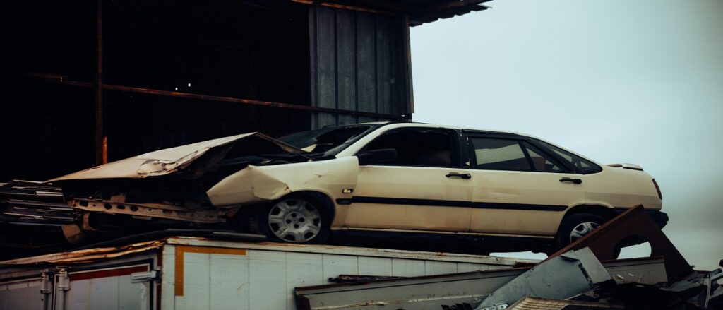 Picture of crashed car on top of truck associated with blog on last clear chance in auto crashes