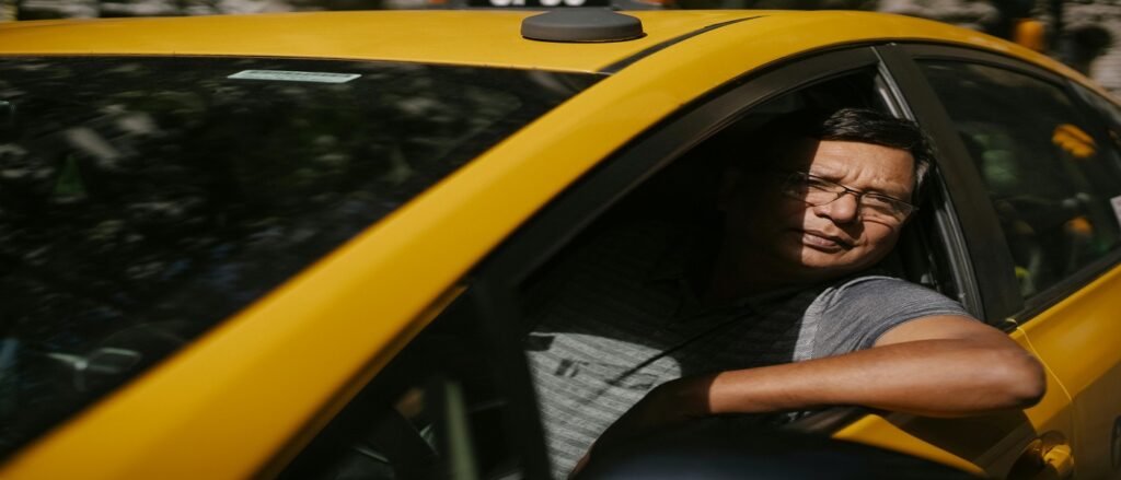 Picture of taxicab driver in his cab associated with blog on car accidents with taxicabs in northern Virginia