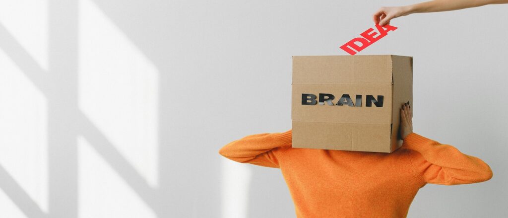 Picture of box on person's head with the word brain on it and ideas flowing into it associated with blog on neurological medical malpractice