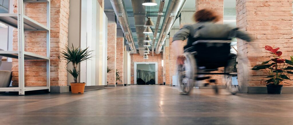 Picture of person moving in wheelchair associated with blog on stroke malpractice