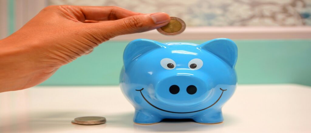 Picture of person putting money into piggy bank associated with blog on wrongful death distributions