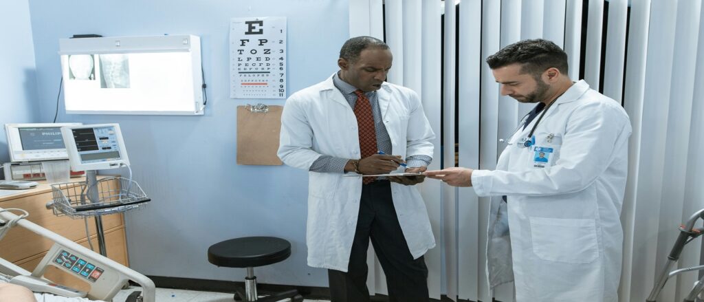 Picture of doctors consulting associated with blog on federal defense medical exams personal injury