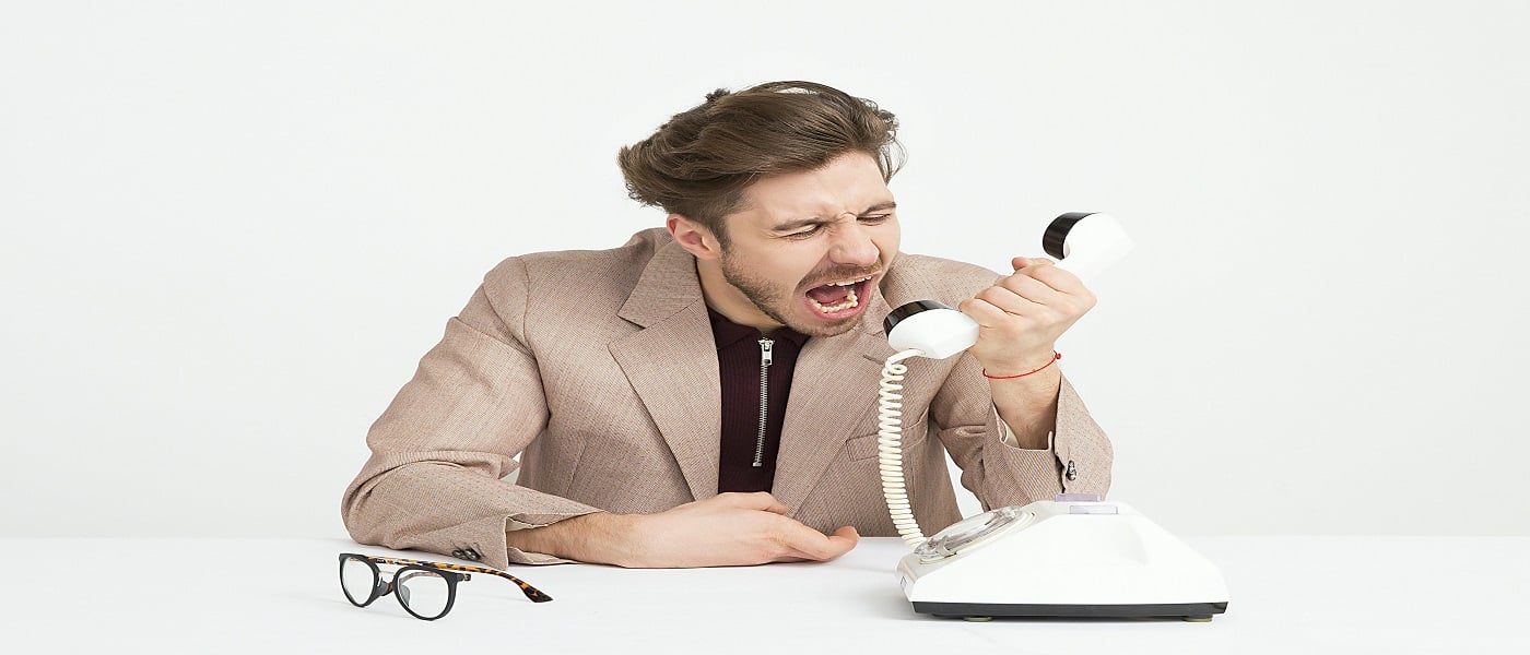 Picture of man yelling into phone associated with blog on proving personal injury damages emotional